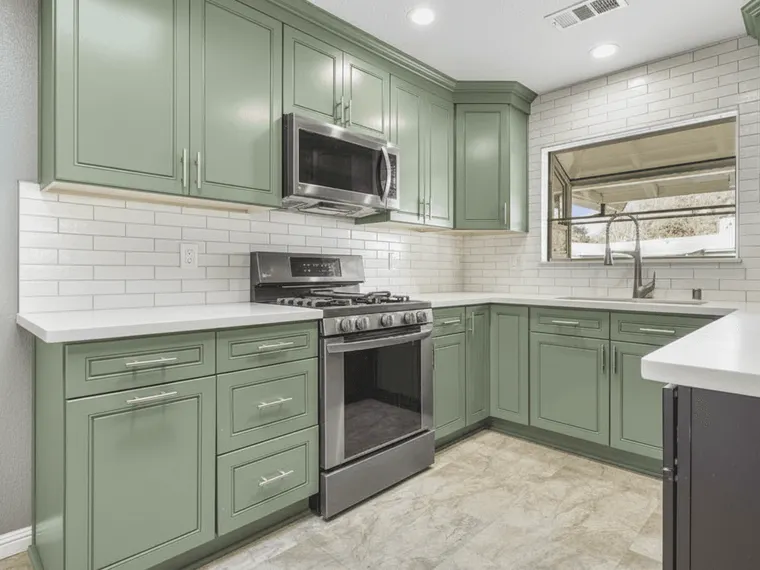 Kitchen renovation idea: existing cabinets repainted sage green