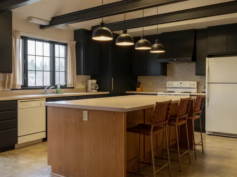 Modern barndominium kitchen idea: black flat-panel cabinets, black beams on the ceiling, black grid window, black dome pendants over the oak island