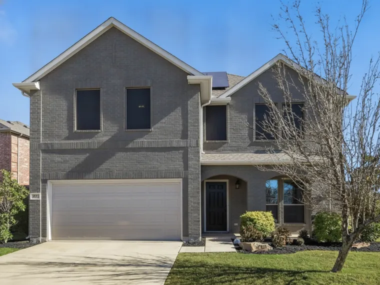 Exterior renovation idea: red brick house painted charcoal