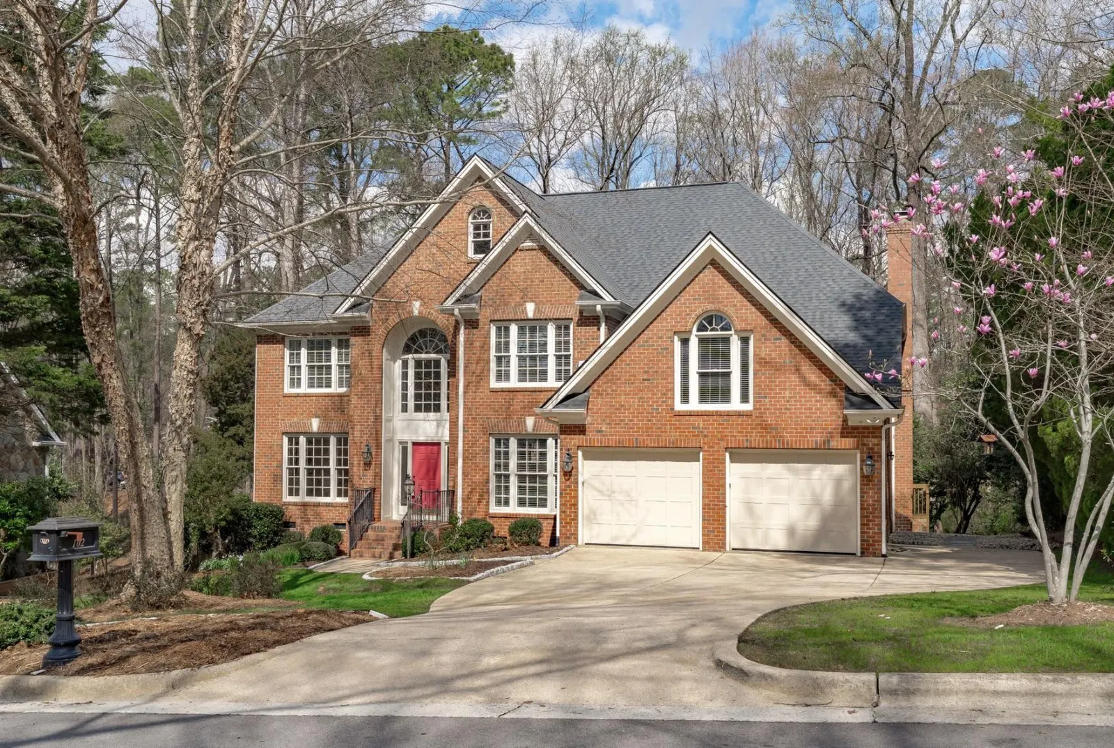 How to Modernize a 1990s Brick House Exterior Without Painting the Brick
