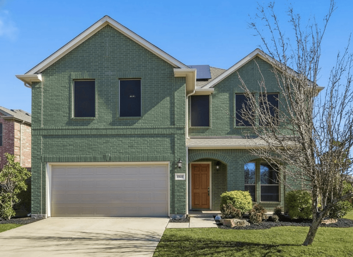 Same brick house painted deep sage green with white trim and natural wood front door — dark sage direction