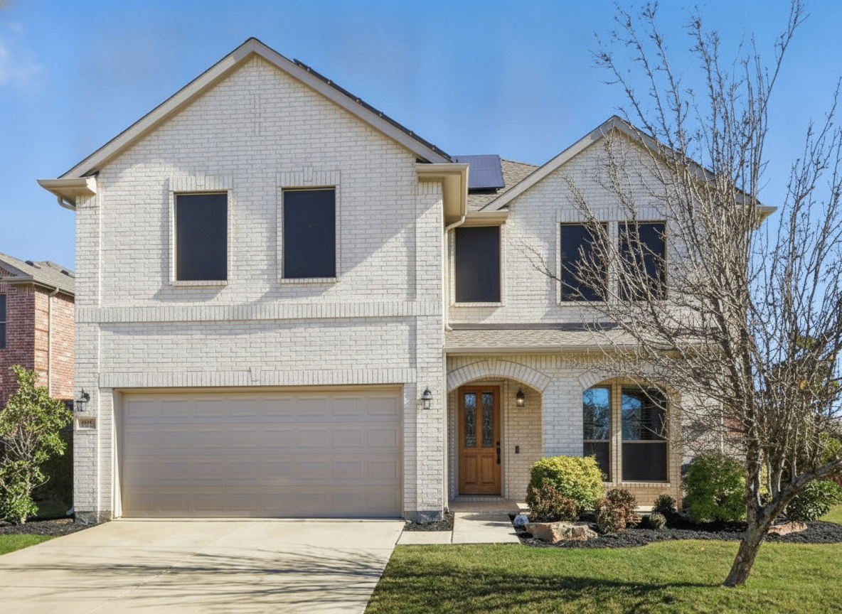 The same house with warm white painted brick and a natural wood front door, driveway and landscaping unchanged